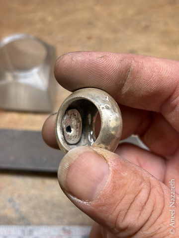 Looking into the dome of the ring, there's a large bubble of silver filling most of the hollow
